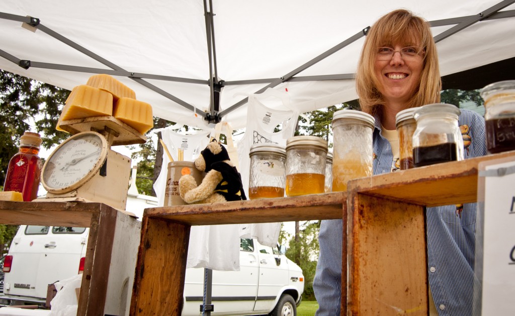 Lisa Phillips of RoundTuit Farms selling honey at the Oak Harbor Farmer's Market